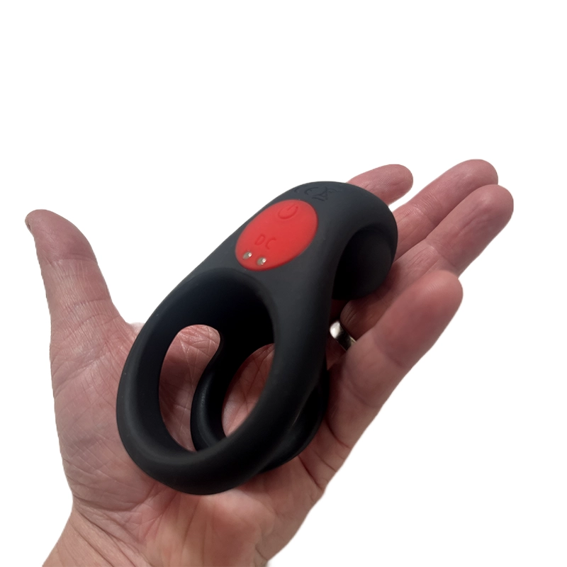 Top-down view of The Colossus vibrating ring in the palm of a hand to demonstrate its scale - Alpha Lover