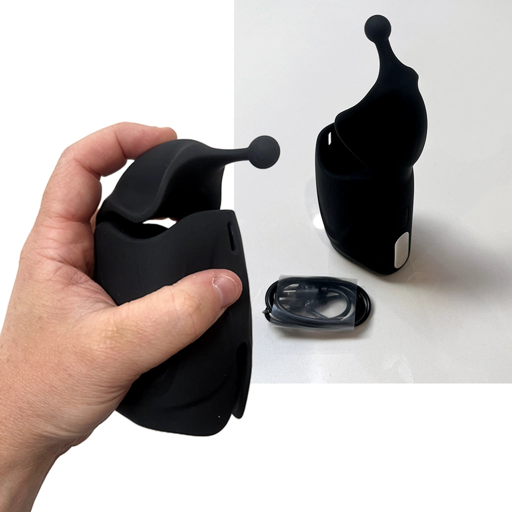 The Edger stroker shown with its magnetic USB charger and premium packaging - Alpha Lover